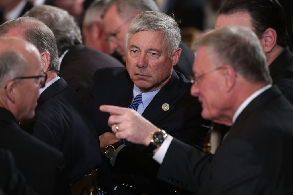 Photograph of Representative Fred Upton amid a group of other policymakers