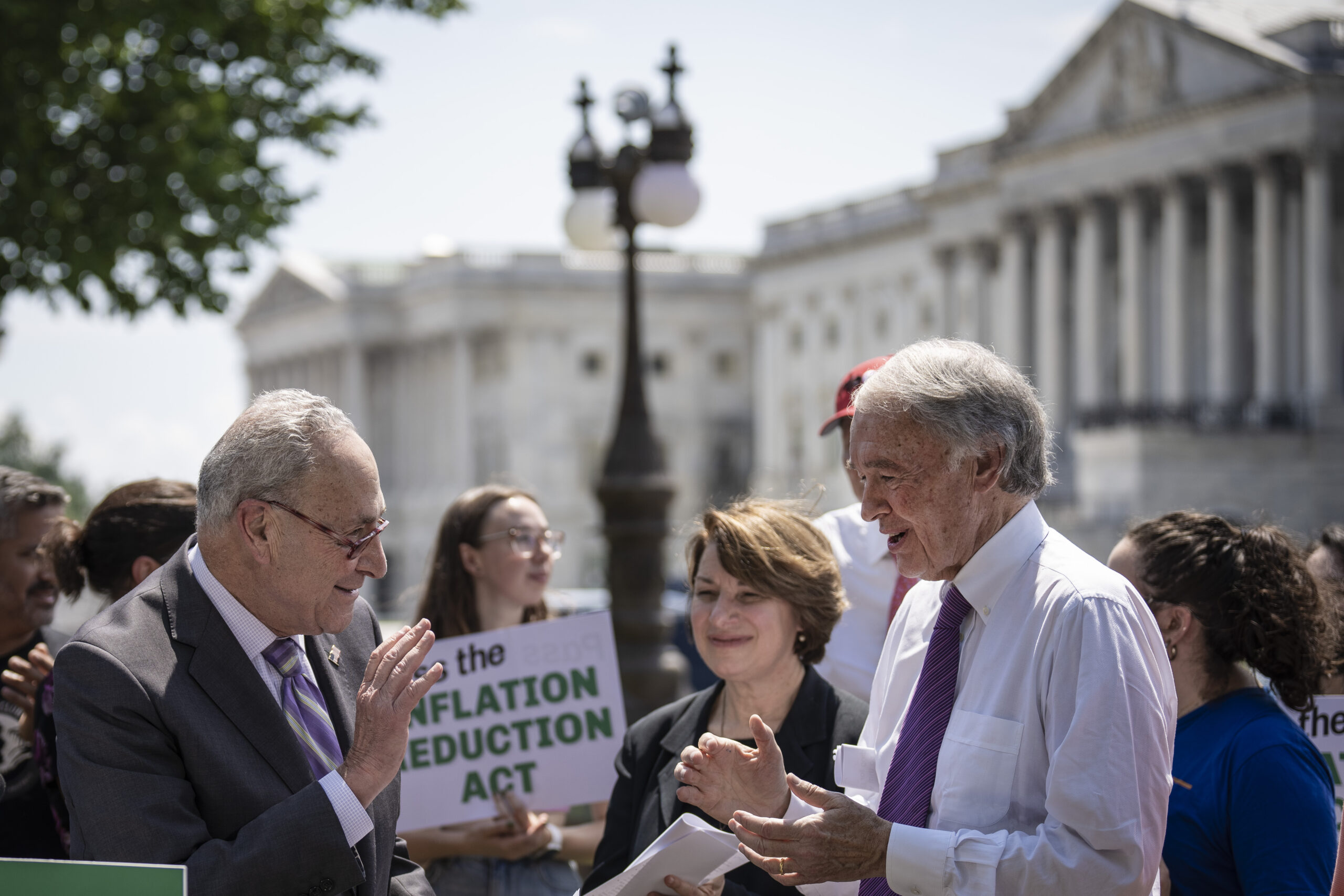 Democratic senators discussing climate provisions in the inflation reduction act