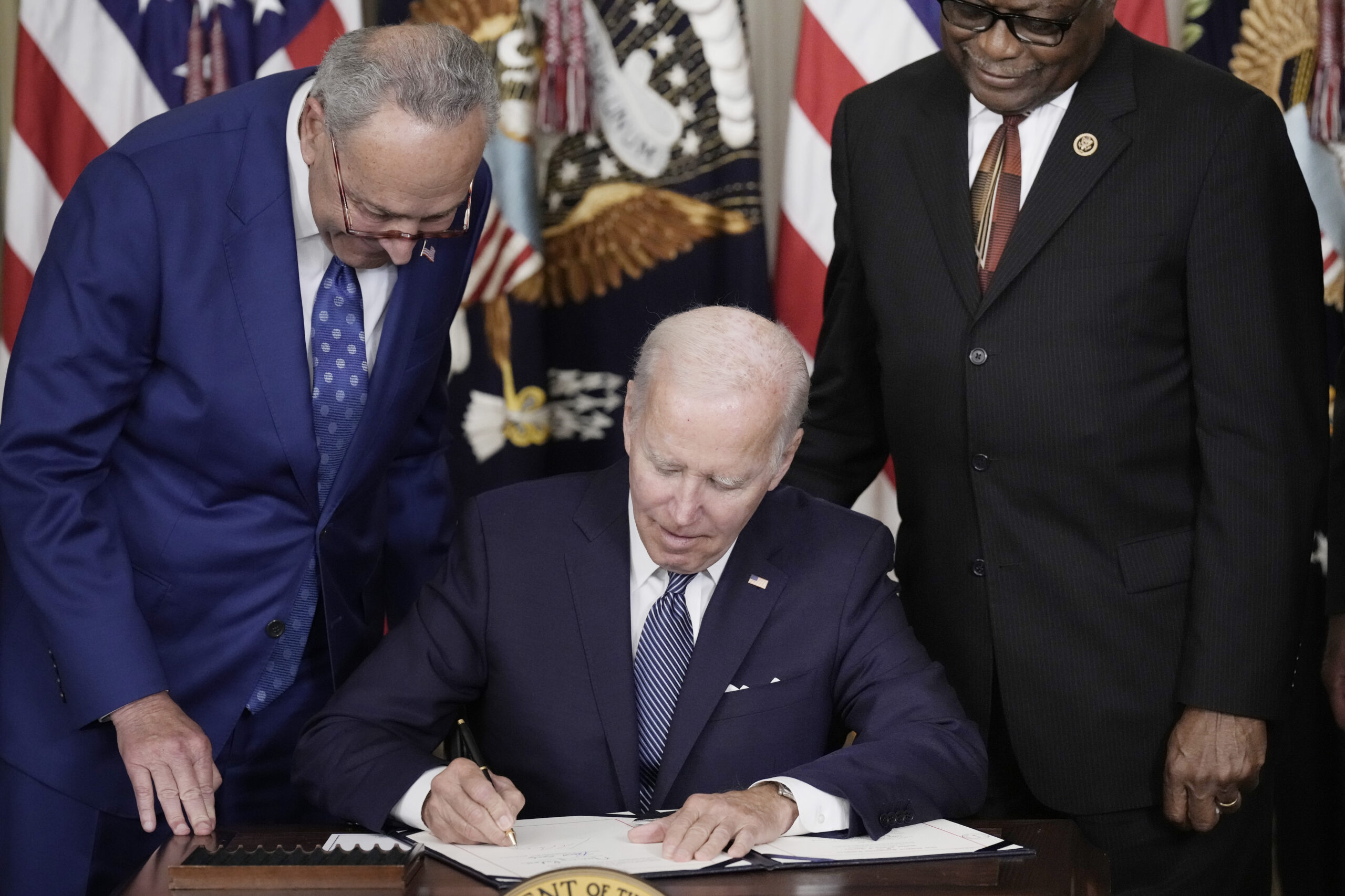 Biden signing the inflation reduction act