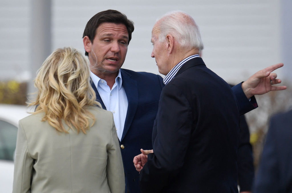 Image of Florida Gov. Ron DeSantis speaking with President Joe Biden and first lady Jill Biden.